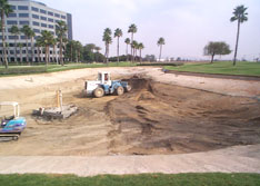 United Storm Water equipment excavating a lake bed to prepare for lake liner installation