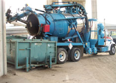 United Storm Water vactor offloading sludge into dewatering bin